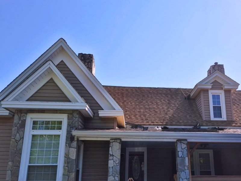Old Roofing Shingles on House with Chimneys